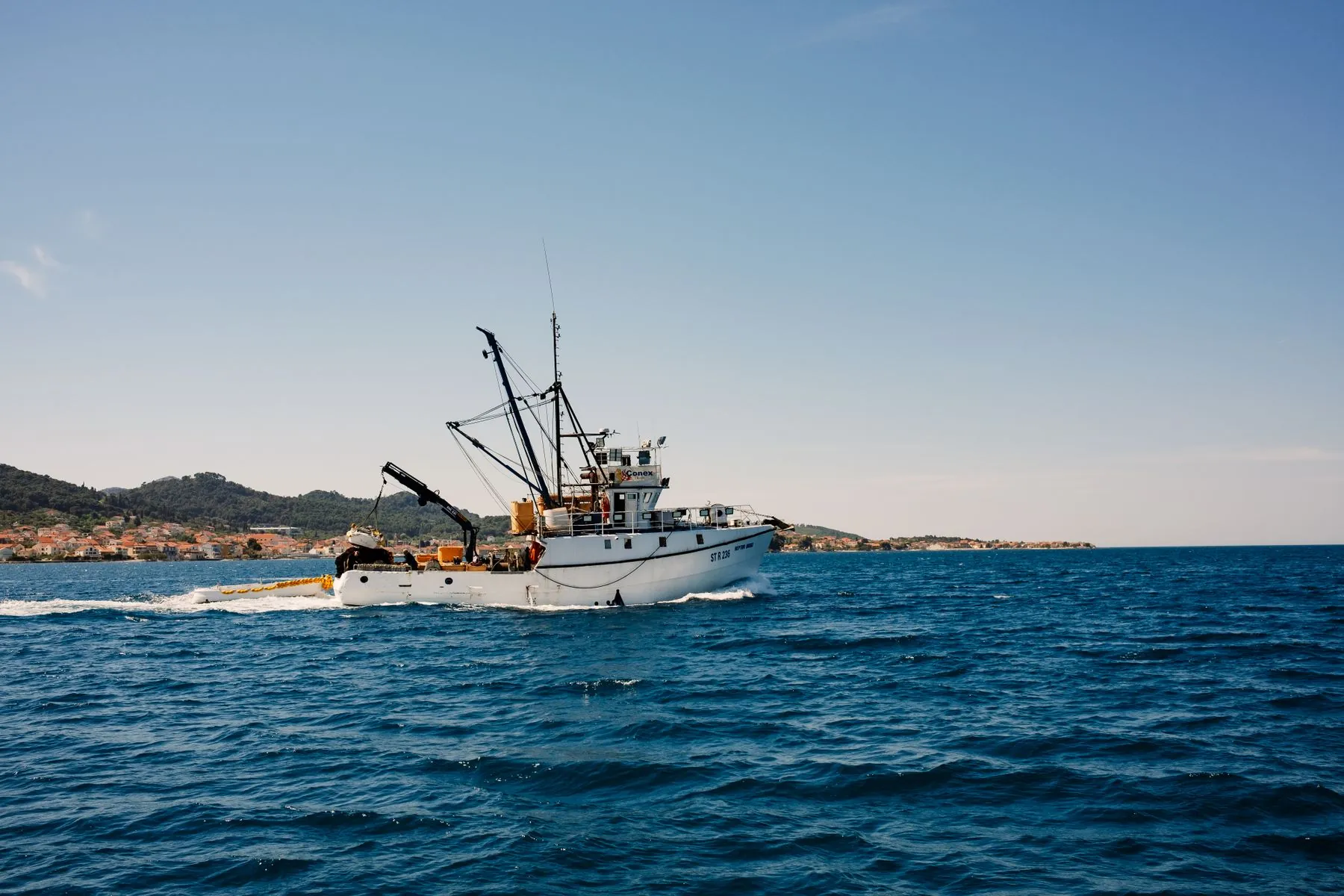 A fishing trawler underway at sea
