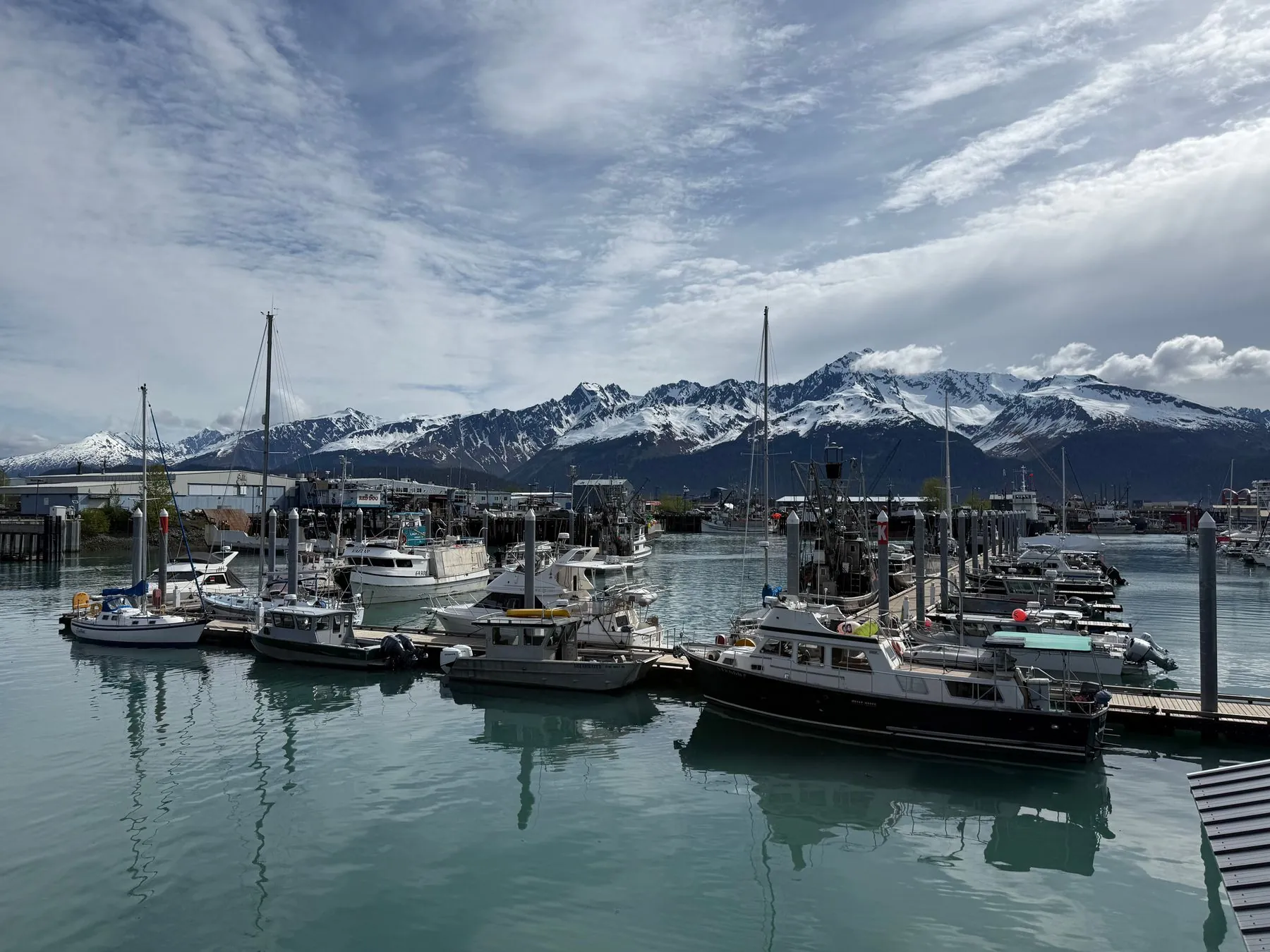 A small-boat harbor in Seward, Alaska, under snow-capped mountains
