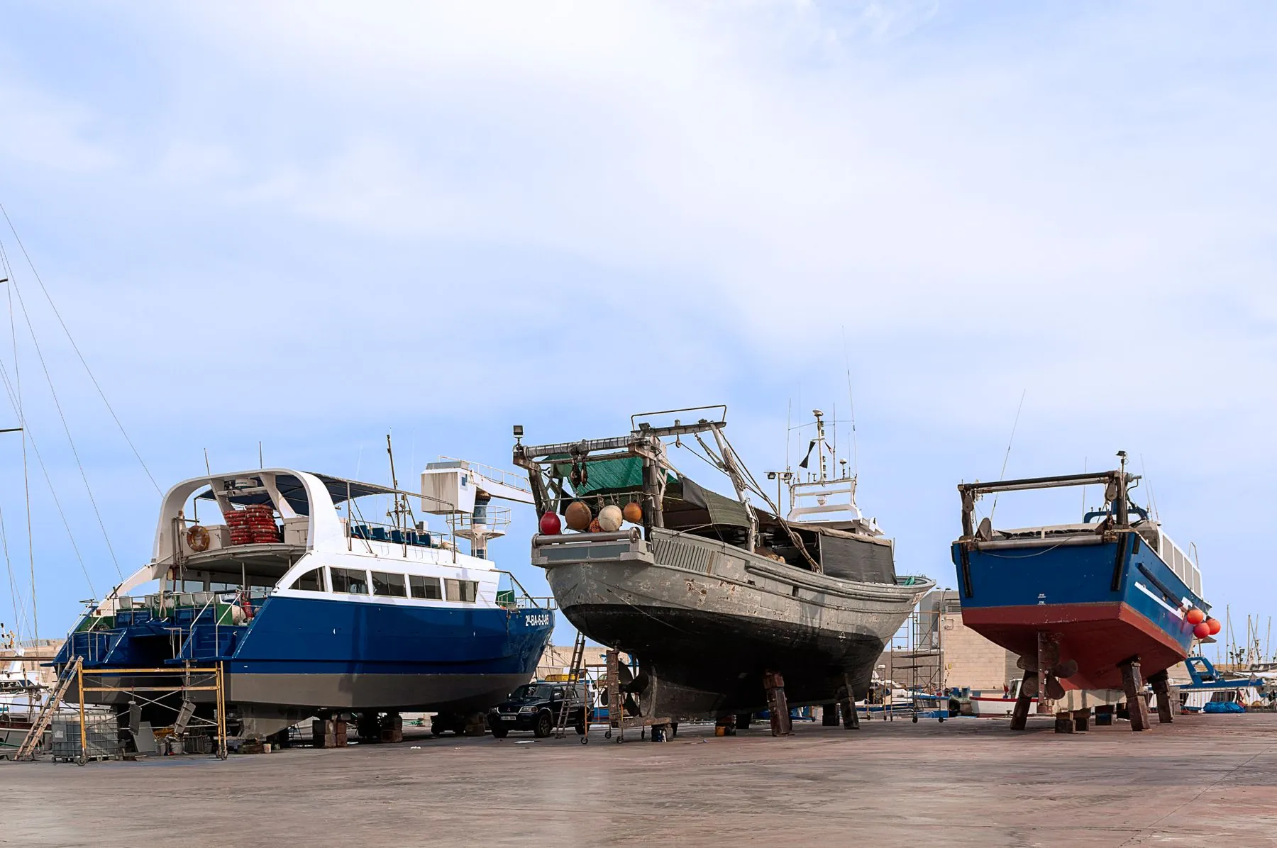Boats blocked up on the hard in a boatyard for repairs